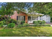 Charming brick home with a well-manicured front yard and inviting entrance at 519 Jacobs Rdg, Fort Mill, SC 29715