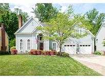 Charming two-story home featuring a well-manicured lawn, three-car garage, and inviting curb appeal at 6425 High Creek Ct, Charlotte, NC 28277