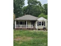 Charming single-story home with a cozy front porch, though it appears damaged from fire at 721 S Spruce St, Rock Hill, SC 29730