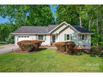 Charming single-story home with well-manicured lawn and inviting landscaping at 177 Candlestick Dr, Statesville, NC 28625