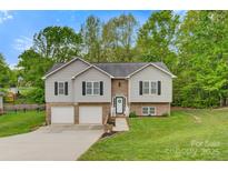 Charming two-story home with a well-manicured lawn, a two-car garage, and tasteful landscaping at 2835 24Th Street Ne Dr, Hickory, NC 28601