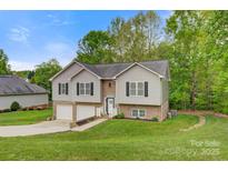 Charming two-story home with a well-manicured lawn and a two-car garage at 2835 24Th Street Ne Dr, Hickory, NC 28601