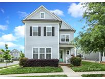Charming two-story home featuring a manicured lawn and inviting curb appeal at 13624 Jacks Ln, Pineville, NC 28134