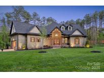 Stunning craftsman-style home with manicured lawn, stone accents, and a welcoming entryway at 425 W North Corner Rd, Lancaster, SC 29720