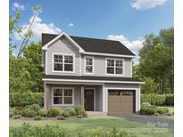 Charming two-story home with a mix of board and shingle siding, attached garage, and well-manicured landscaping at 1020 Forest Dr, Marshville, NC 28103