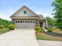 Charming single-Gathering home with a two-car garage, manicured landscaping, and a welcoming front facade at 1026 Kirby Dr, Fort Mill, SC 29715
