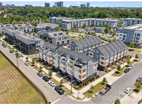 New townhome community boasting modern architecture and meticulous landscaping in a desirable neighborhood at 2111 Isom St, Charlotte, NC 28208