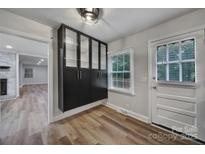 A bright entryway features custom cabinetry and a window bringing in natural light at 7531 Linda Lake Dr, Charlotte, NC 28215