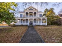 Charming two-story home featuring a covered front porch and classic architectural details at 121 York St, Chester, SC 29706