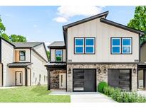 Charming two-story house features modern design, stone accents, and a well-manicured lawn at 2015 Wilson Ave, Charlotte, NC 28208