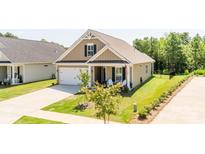 Charming single-Gathering home featuring a well-manicured lawn, attached garage, and a welcoming front porch at 3619 Whitney Way, Terrell, NC 28682