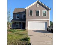 Charming two-story home with a two-car garage and well-maintained lawn and lovely curb appeal at 804 Yorkshire Dr, Albemarle, NC 28001