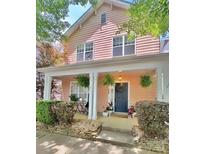 Charming two-story home with a welcoming front porch and tasteful landscaping at 240 Faust Rd, Davidson, NC 28036