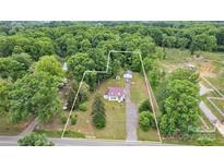 An aerial view of the property, surrounded by lush trees, showcasing the home's location at 3101 Hickory Hwy, Statesville, NC 28677