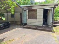 Shows exterior and carport of a house at 4019 Tucker Rd, Belmont, NC 28012