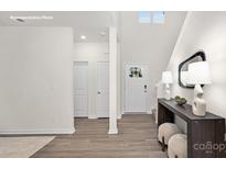 Bright entryway featuring a white front door, stylish console table, and modern decor at 448 Berryman Rd, Rock Hill, SC 29732