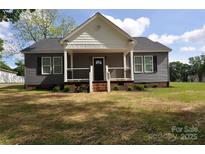 Charming one-story home featuring a cozy front porch and well-manicured lawn at 602 Still St # 1 Blk C, Chester, SC 29706