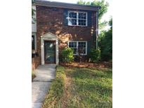 Traditional brick home with green shutters and well-kept landscaping creates a welcoming curb appeal at 8835 Hunter Ridge Dr, Charlotte, NC 28226