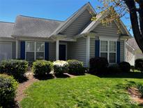 Charming single-story home featuring manicured landscaping and a well-maintained lawn at 2008 Taras Trace Dr, Statesville, NC 28625