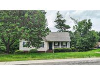 Charming single-story home featuring a cozy front porch and well-maintained landscaping at 735 Shuttles Way, Fort Mill, SC 29715