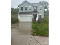 Two story home with gray siding, white trim, two car garage and concrete driveway at 113 Stoney Ln, Cherryville, NC 28021