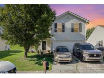 Charming two-story home with a well-maintained lawn and a two-car garage at 1346 Mandy Place Ct, Charlotte, NC 28216