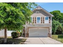 Charming two-story home with a two-car garage, stone accents, and mature landscaping at 2751 Bramble Ridge Ct, Charlotte, NC 28215