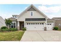 Charming home with a two-car garage and well-maintained landscaping in a modern color palette at 3333 Oliver Stanley Trl, Lancaster, SC 29720