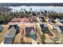 Lakefront community featuring beautiful single Gathering homes near a calm waterway, perfect for relaxation and recreation at 11249 Island View Ln, Lancaster, SC 29720