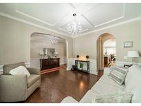 Elegant living room featuring hardwood floors, recessed lighting, and decorative chandelier at 16507 Palisades Commons Dr, Charlotte, NC 28278