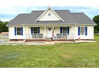 Charming single-story home featuring a welcoming front porch and blue shutters at 3300 Luke Ct, Monroe, NC 28112