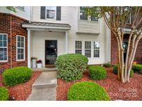 Charming townhome with a well-manicured front yard and inviting entrance at 4132 Kenton Glenn Nw Ct, Concord, NC 28027