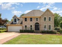 Charming brick two-story home with well-manicured lawn and attached garage at 109 Arabian Ln, Salisbury, NC 28147