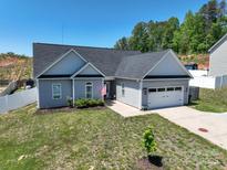 Charming single-Gathering home features a two-car garage, vinyl siding, and a well-manicured lawn at 2205 Philadelphia Church Rd, Dallas, NC 28034