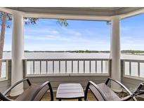 Relaxing screened porch featuring serene lake views and comfortable seating at 372 Northwest Dr, Davidson, NC 28036