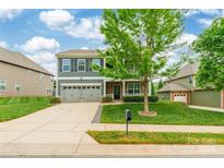 Charming two-story home with a two-car garage, covered porch, and well-manicured lawn at 9109 Loch Glen Way, Charlotte, NC 28278