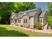 Charming home with solar panels, American flag, and well-maintained lawn at 3243 Farmcrest Ct, Fort Mill, SC 29708