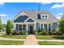 Charming craftsman-style home with well-manicured lawn and inviting front porch at 3588 County Down Ave, Kannapolis, NC 28081
