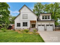 Charming two-story home with a two-car garage, featuring a manicured lawn and inviting entrance at 1816 Lisbon Ln, Charlotte, NC 28269