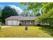 Charming single-story home with a two-car garage and inviting front porch, set on a well-maintained lawn at 2379 Whitley Rd, Fort Mill, SC 29708