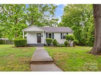 Charming single-story home with a cozy front porch and well-maintained landscaping at 93 34Th Street Nw Ct, Hickory, NC 28601