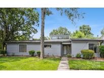 Charming single story home featuring a manicured lawn and tidy landscaping at 11216 Carmel Chace Dr, Charlotte, NC 28226