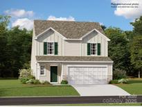 Charming two-story home with a two-car garage and inviting curb appeal on a sunny day at 2159 Trollinger Dr, Catawba, NC 28609