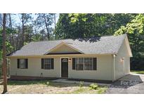 Charming single story home with black shutters and a well-maintained front yard at 7525 Cedarbrook Dr, Charlotte, NC 28215