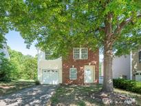Charming two-story home with a combination of brick and siding, plus an attached one car garage at 2017 Beckwith Ln, Waxhaw, NC 28173