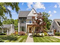 Charming two-story home featuring a manicured lawn and inviting front porch at 2509 Bay St, Charlotte, NC 28205
