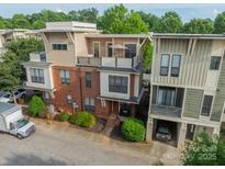 A modern townhouse with a rooftop terrace and unique architectural details at 2988 Textile Way, Charlotte, NC 28205