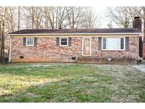 Charming brick ranch home with a well-maintained lawn and inviting front entrance at 393 Carson Dr, Gastonia, NC 28052
