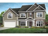 Charming two-story home featuring a stone facade, inviting front porch, and a well-manicured lawn at 4244 Dahlia Dr # Cge0036, Harrisburg, NC 28075