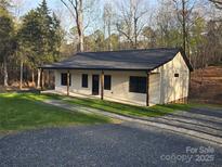 Charming home exterior with modern design and a well-manicured front yard at 107 Skyland Dr, Mount Gilead, NC 27306